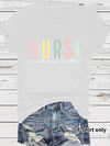 Nurse Care, Inspire, Heal T-Shirt in White, front view on a model, tucked into denim shorts
