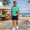 Cosmic Nurse men's polo shirt worn with shorts on a beachfront terrace, front view with the nurse printed at the hip