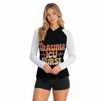 Trauma ICU Nurse hooded sun shirt, front view: TRAUMA ICU NURSE in thick retro lettering with a heartbeat line across the chest, contrast raglan sleeves, worn on a plain backdrop