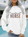 Registered Nurse Hearts Pullover Sweatshirt in White, front view on a model by a pool
