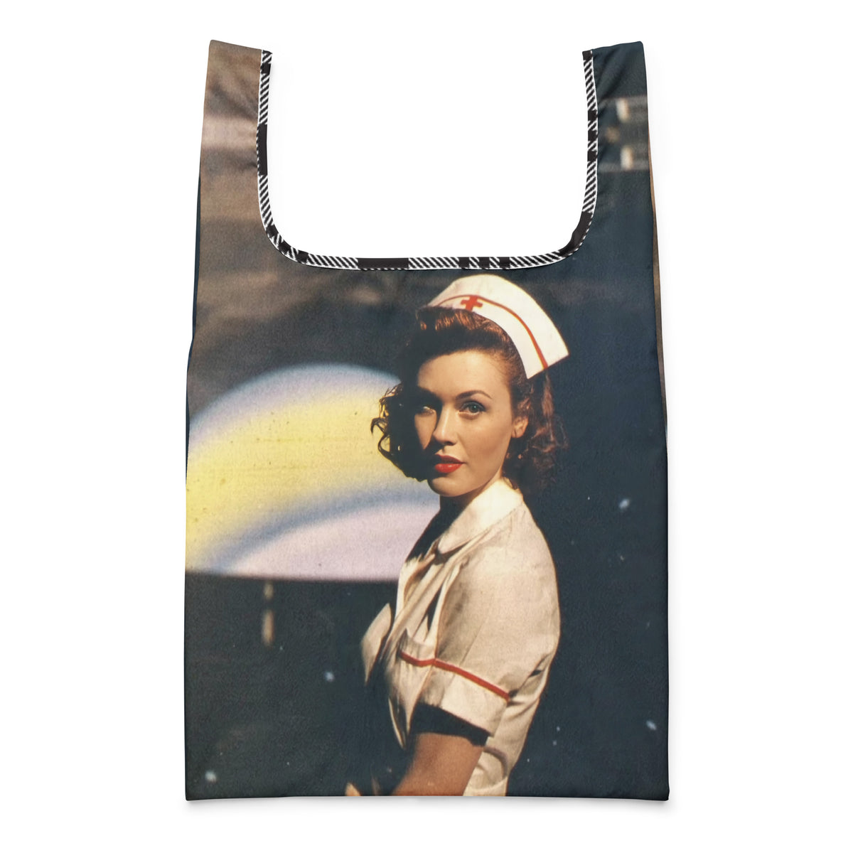 Cosmic Nurse shopping bag, front view: a 1940s nurse under a glowing ringed planet printed edge to edge, checked trim