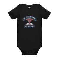 Doctor in Training D.O. baby one-piece bodysuit in black, front view