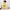 Doctor in Training D.O. baby one-piece bodysuit in yellow, front view