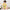 Dentist in Training baby one-piece bodysuit in yellow, worn by a baby in a nursery, cartoon tooth with a toothbrush between JUST A DENTIST and IN TRAINING banners