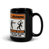 Don't Tell Me How to Do My Job black glossy mug, 15 oz, the WARNING safety-sign placard facing forward with the handle at right, studio view