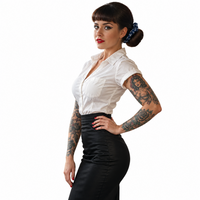 Medical Caduceus Navy Scrunchie worn in a low bun by a pin-up model with rolled sleeves and tattoos at a retro diner counter