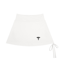 Caduceus women's drawstring A-line yoga skort in white, front view