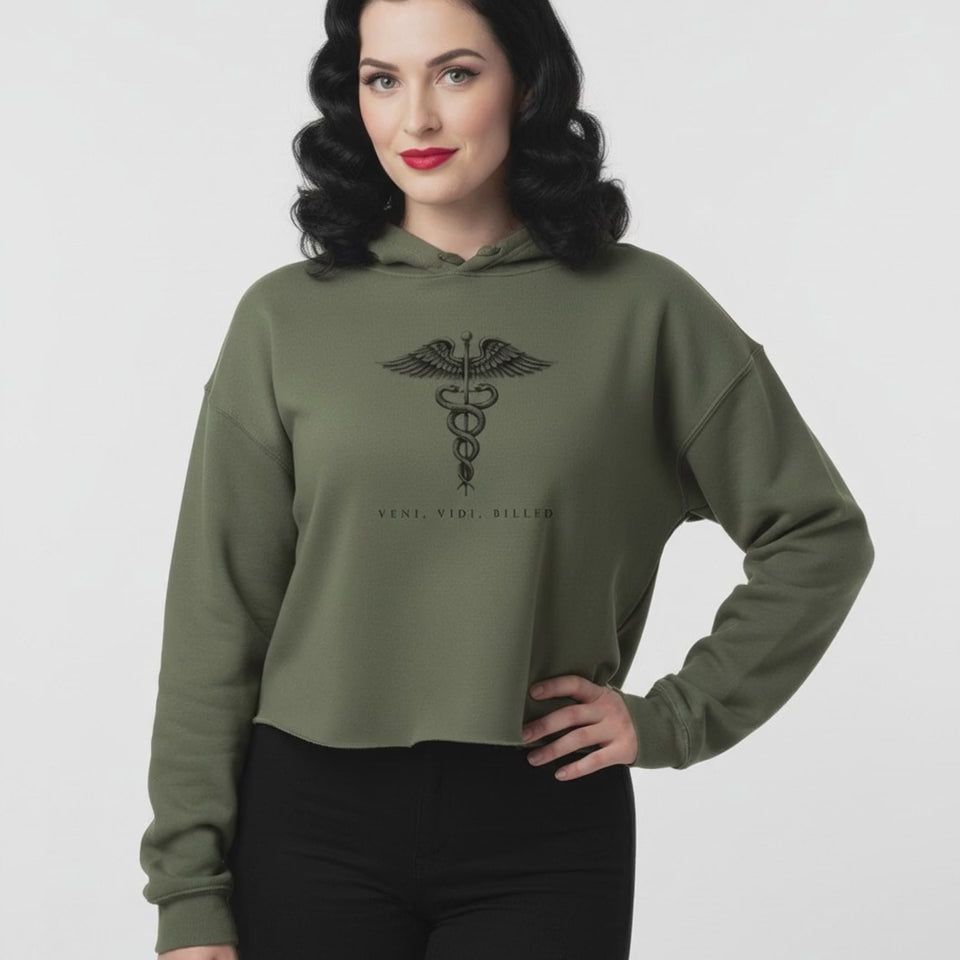 Veni, Vidi, Billed Caduceus Crop Hoodie video: a model in the cropped hoodie, the small caduceus mark centred on the chest