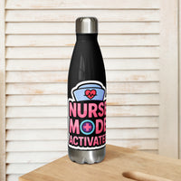 Nurse cap with a heartbeat over NURSE MODE ACTIVATED in block letters, on a black 17 oz stainless steel water bottle, front view