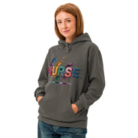 NURSE in glossy multicoloured paint-splash letters on a Pepper garment-dyed unisex hoodie
