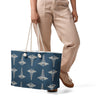 Medical Caduceus Oversized Weekender Bag carried at the side by a person in trousers, front view of the caduceus pattern on ocean blue